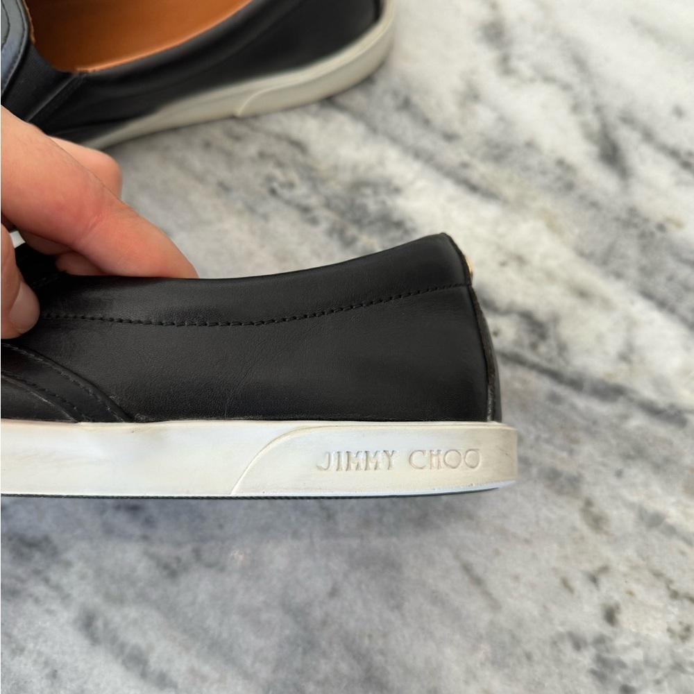Jimmy Choo black leather sneakers.